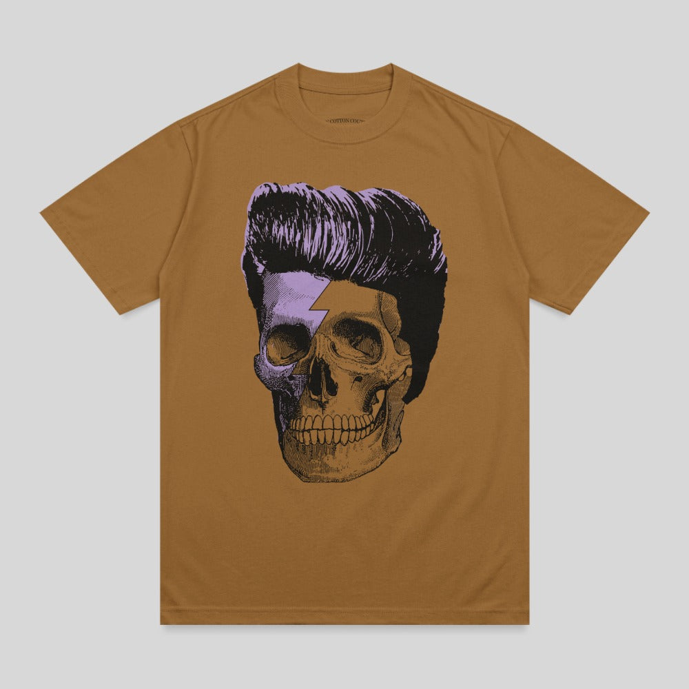 Brown t-shirt with a purple and black graphic of a skull with slicked-back hair and a lightning bolt.
