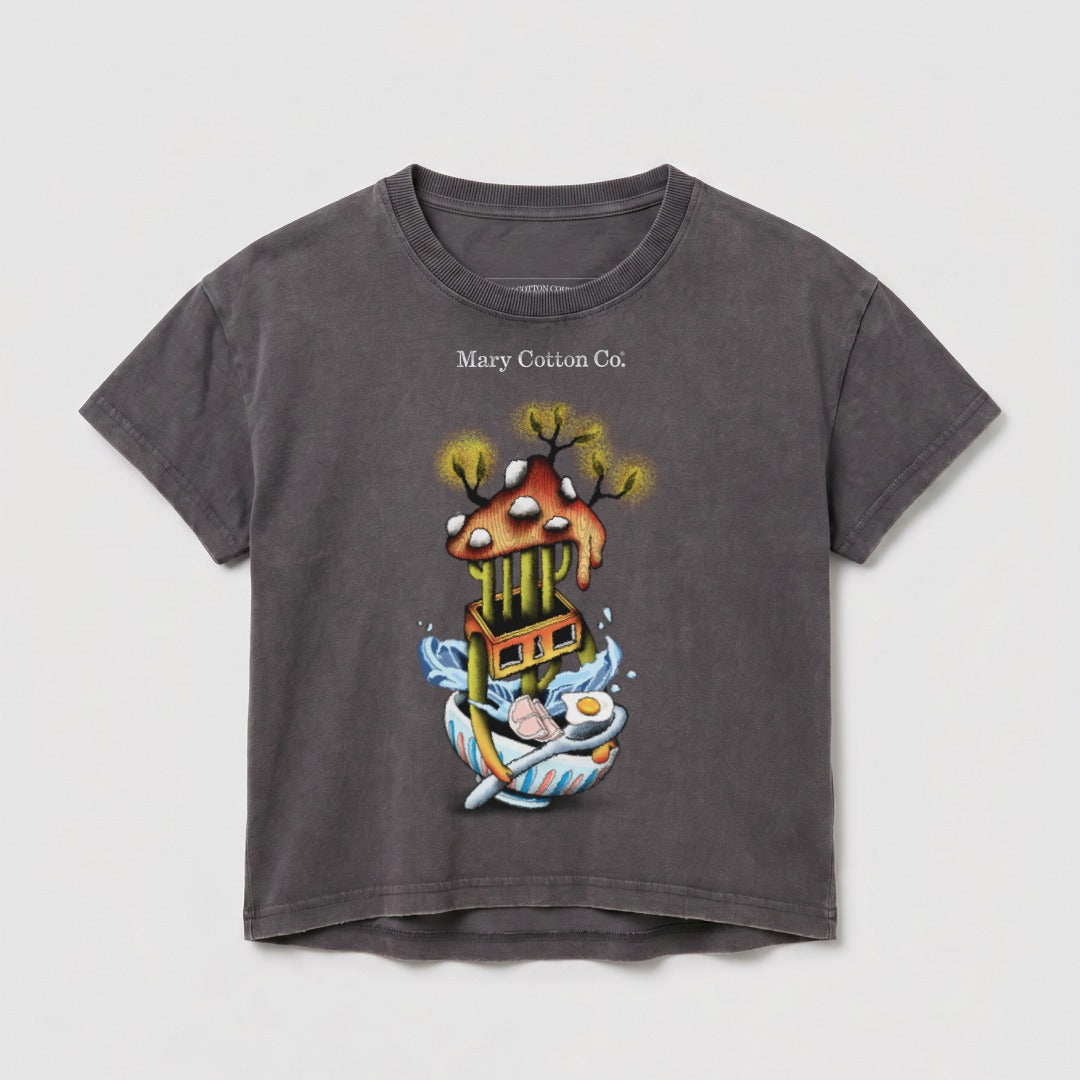 Dark grey t-shirt with whimsical artwork of a mushroom house over a bowl of ramen.