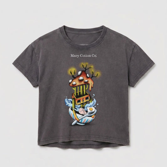 Dark grey t-shirt with whimsical artwork of a mushroom house over a bowl of ramen.