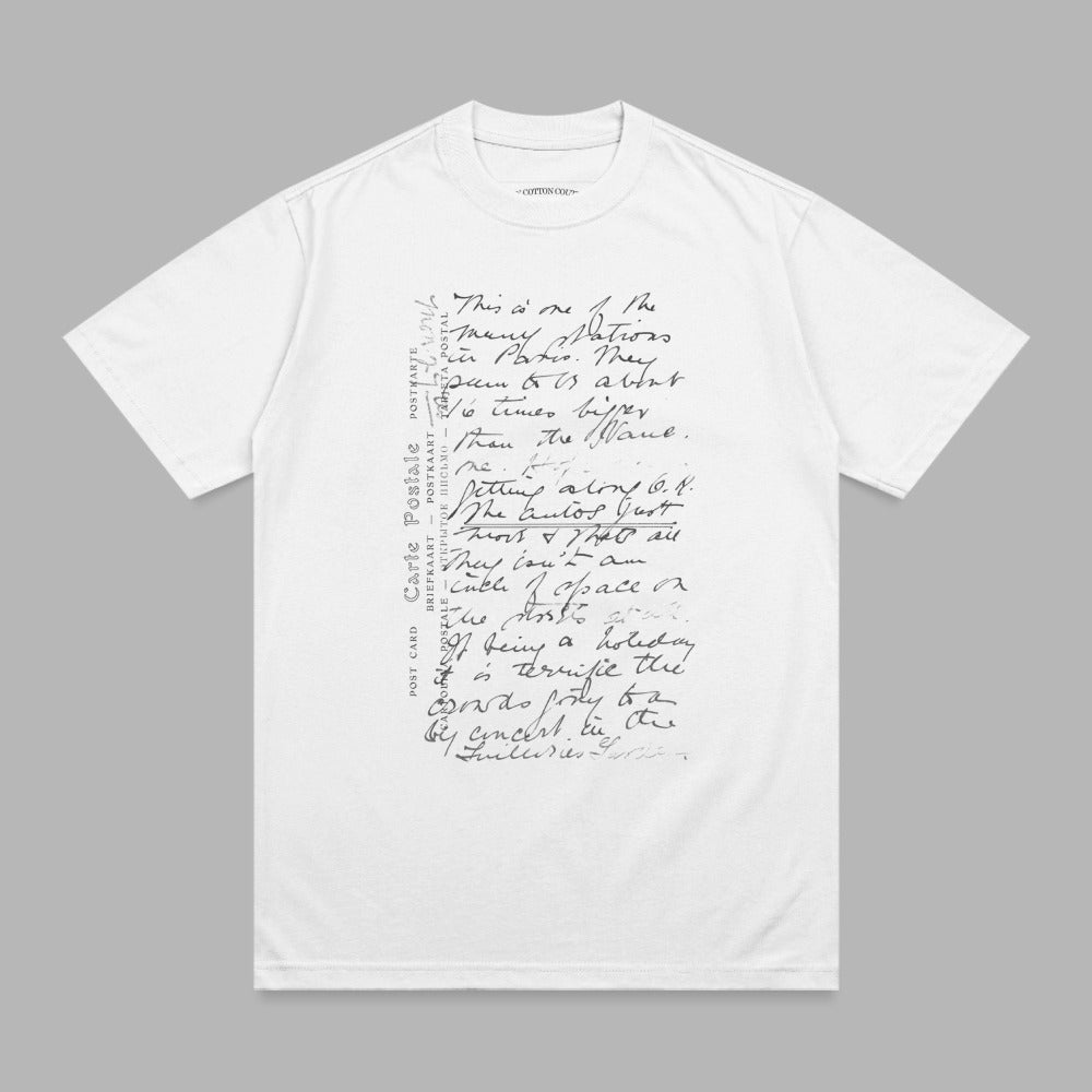 White t-shirt with handwritten script text and postal markings.
