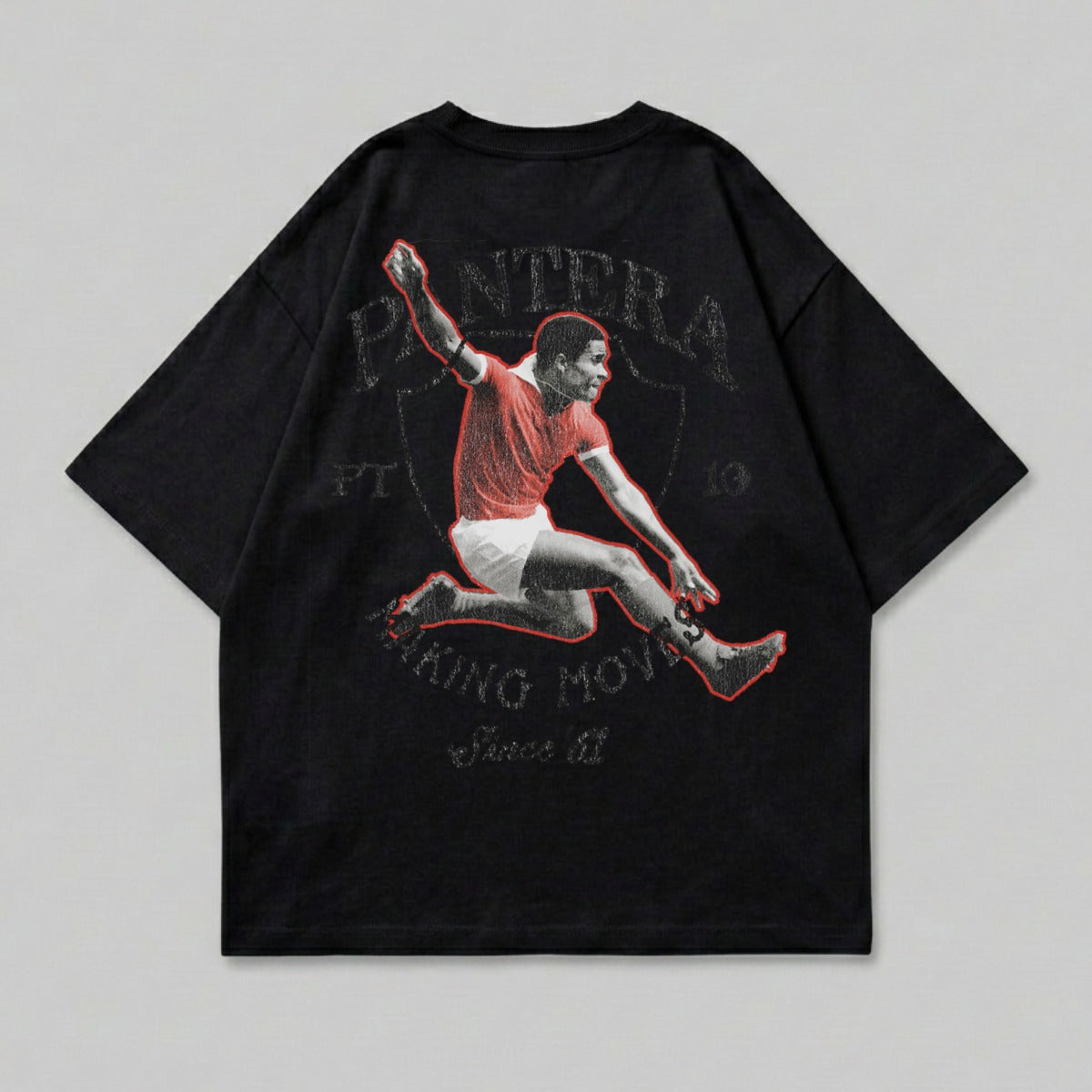 Black t-shirt with graphic of soccer player in mid-air, "Pantera" text above.