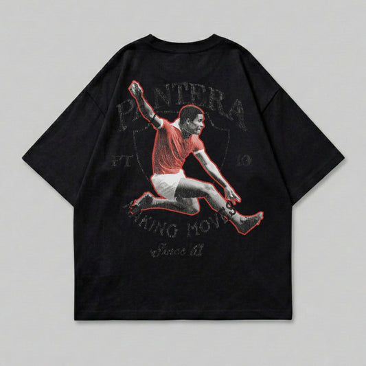 Black t-shirt with graphic of soccer player in mid-air, "Pantera" text above.
