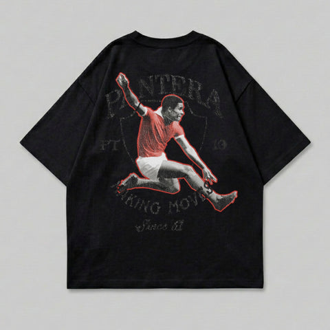 Black t-shirt with graphic of soccer player in mid-air, "Pantera" text above.