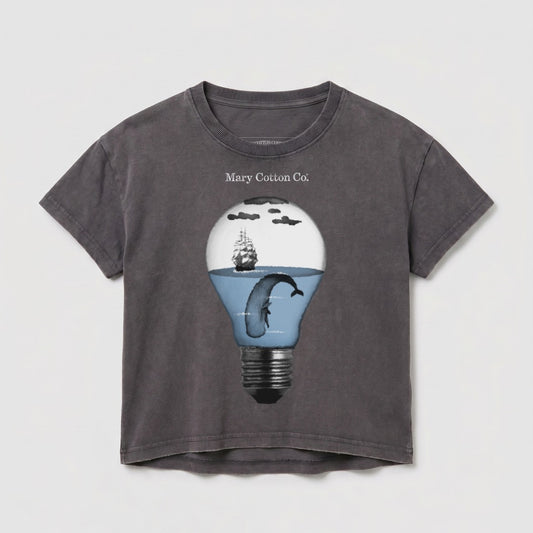 Gray t-shirt with a lightbulb graphic containing a whale and sailing ship.