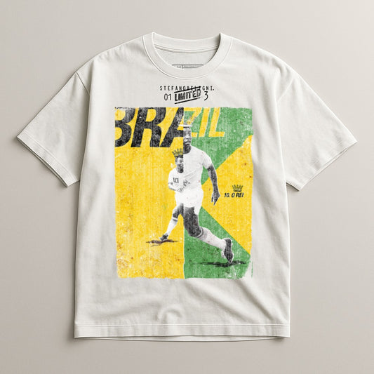 Pele in action on a white t-shirt with Brazil flag design and text.