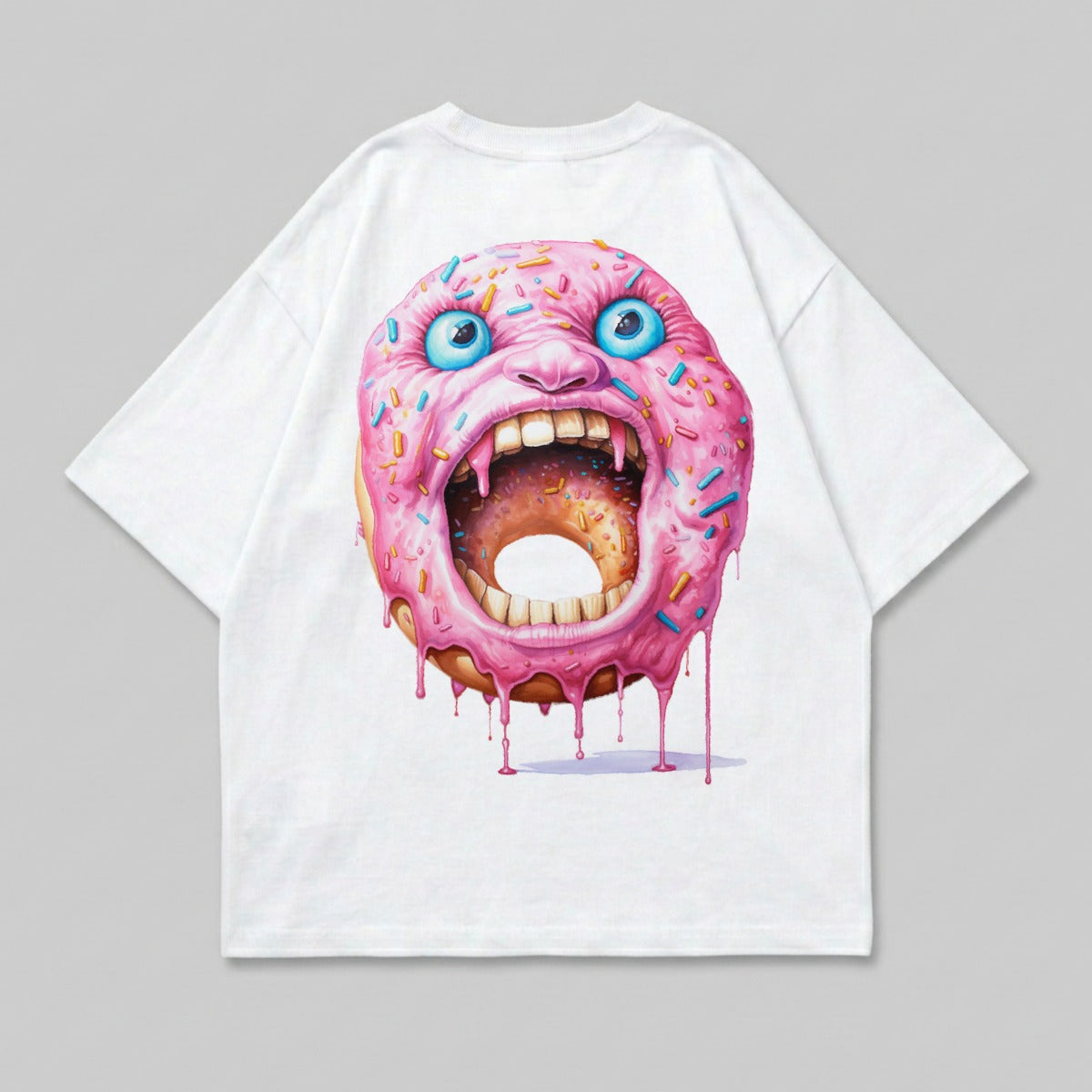 White t-shirt featuring a screaming donut with blue eyes and pink frosting.