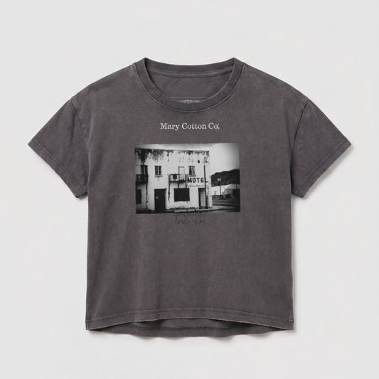 Gray t-shirt with a black and white image of a building and text.