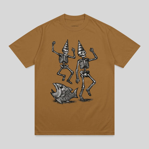 Two skeletons in party hats dance with a fish illustration on a brown t-shirt.