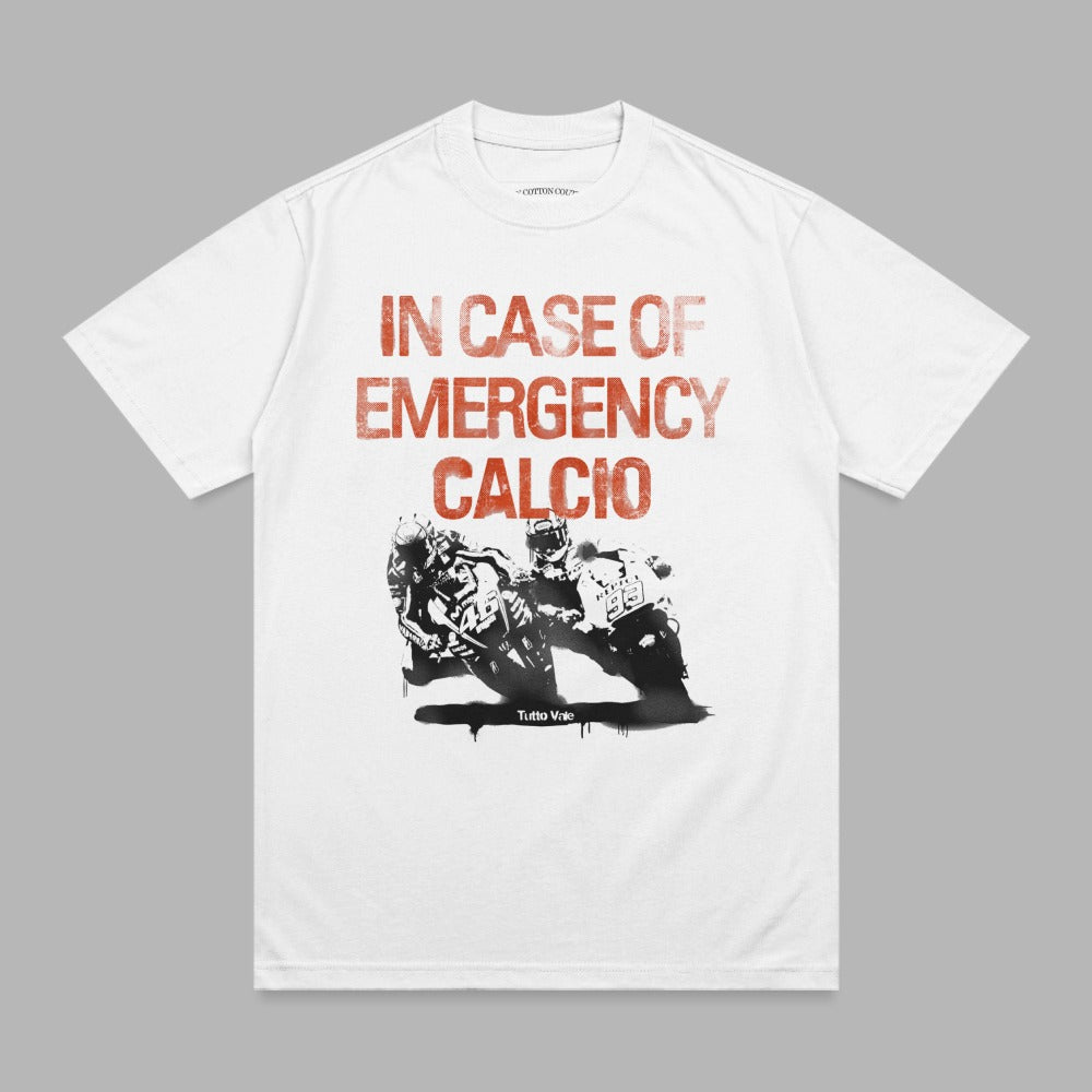 White t-shirt with red distressed text "IN CASE OF EMERGENCY CALCIO" and graphic of soccer players.