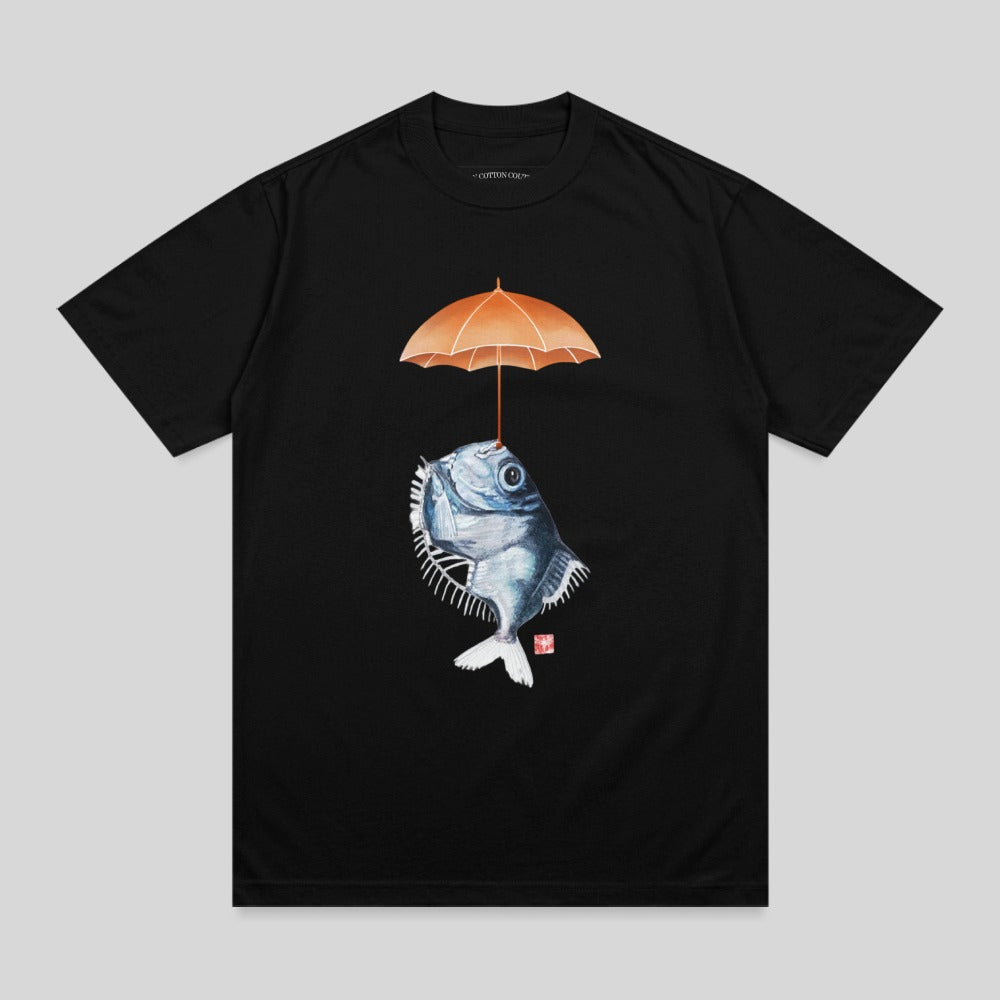 Black t-shirt with illustration of fish holding an orange umbrella above its head.