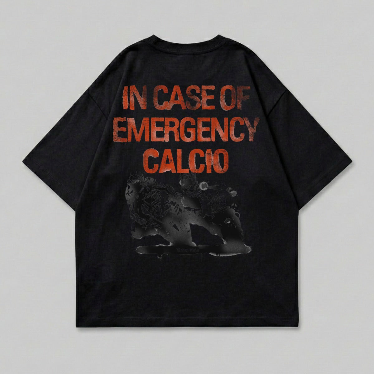 Black t-shirt with orange text reading "IN CASE OF EMERGENCY CALCIO".