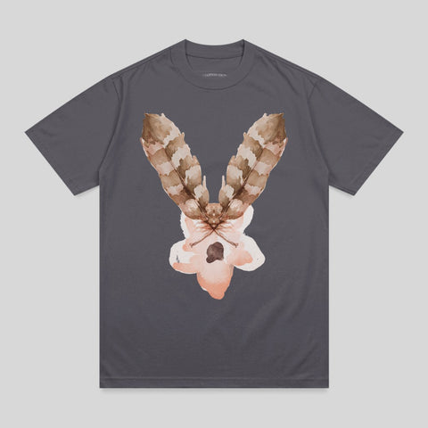 T-shirt with a watercolor moth design featuring feather-like wings and a pale pink body.