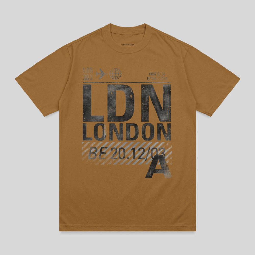 Brown t-shirt with "LDN LONDON" and flight details graphic.