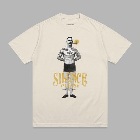 Cream t-shirt with vintage tattoo-style man smoking a pipe, "SILENCE PLEASE" text.