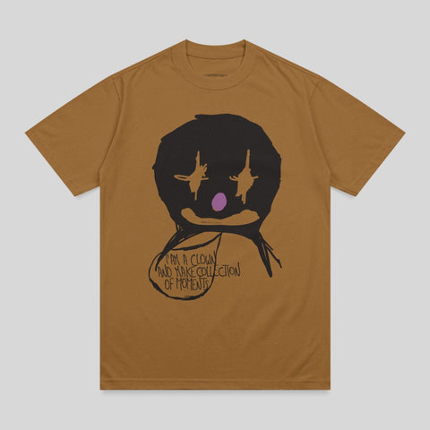 Brown t-shirt with a black clown graphic and "I AM A CLOWN AND MAKE COLLECTION OF MOMENTS" text.