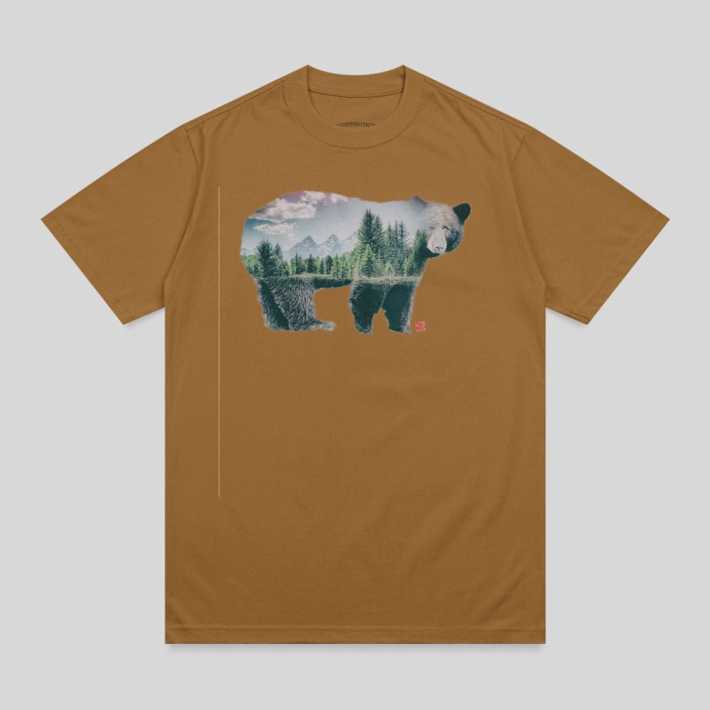 Brown t-shirt with a bear silhouette filled with a forest and mountain landscape.
