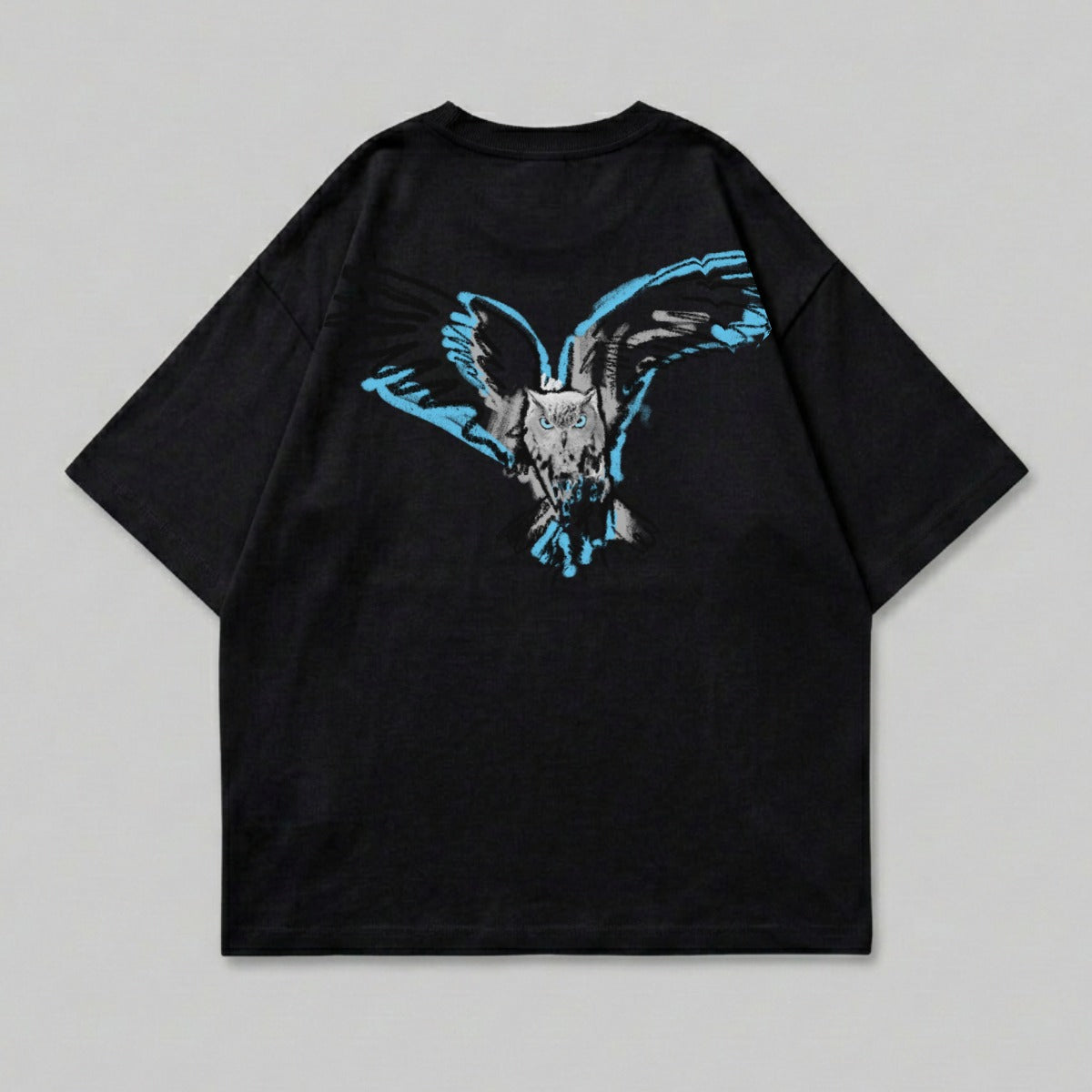 Black t-shirt with a distressed blue and white owl graphic on the back.