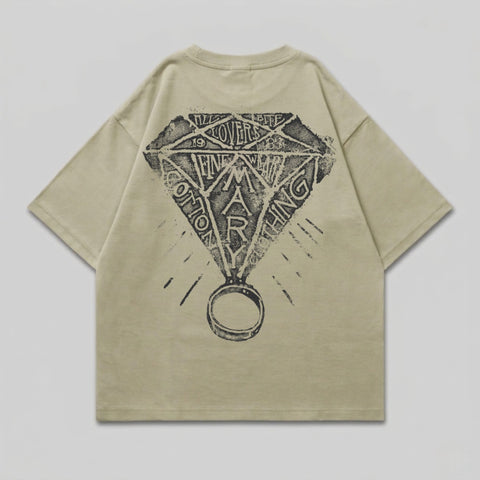 T-shirt with diamond and ring graphic on back.