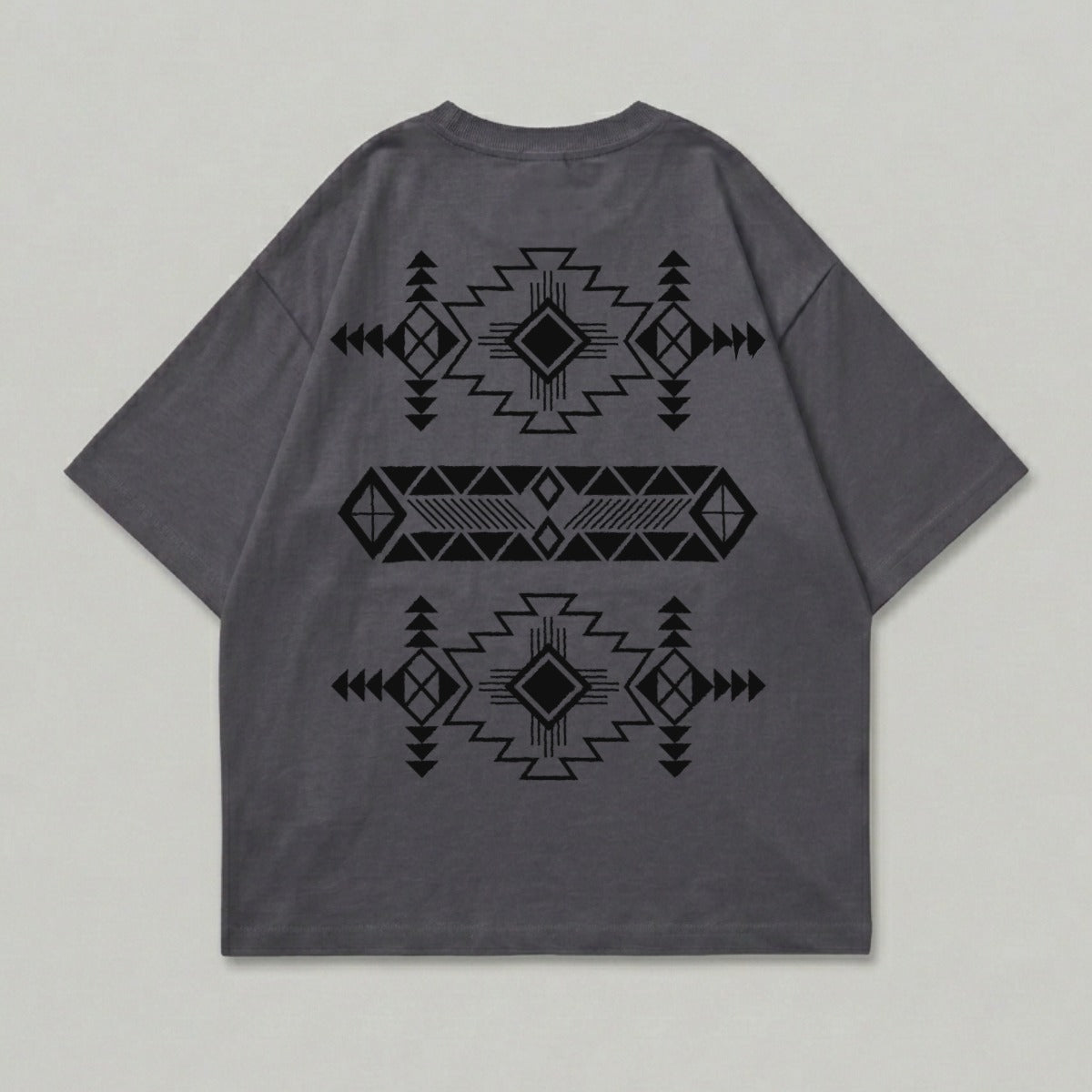 Dark grey t-shirt with black geometric tribal pattern design on back.