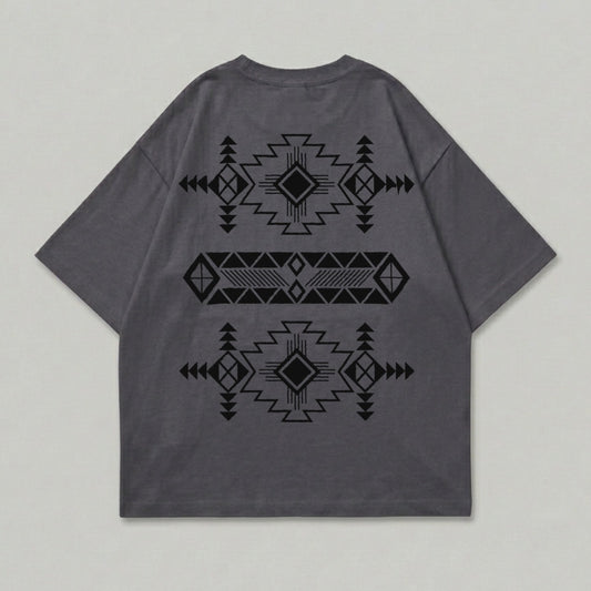 Dark grey t-shirt with black geometric tribal pattern design on back.