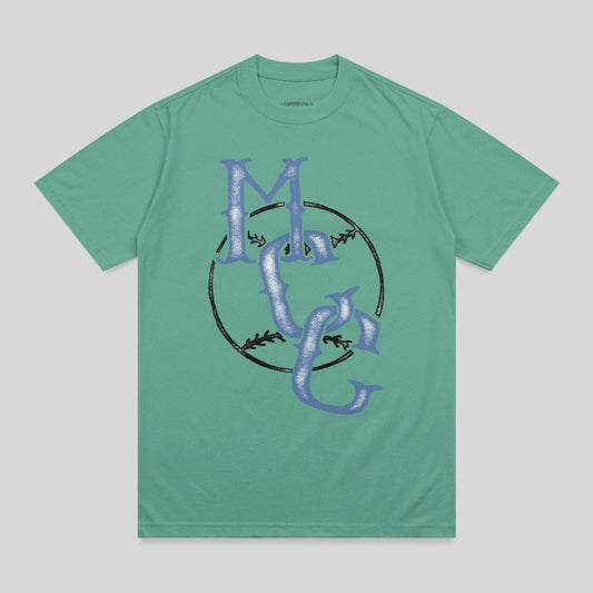 Green t-shirt with a large blue "MC" logo inside a black baseball circle.