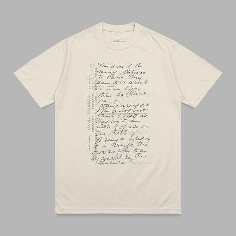 Beige t-shirt with handwritten script text, "This is one of the many nations..."