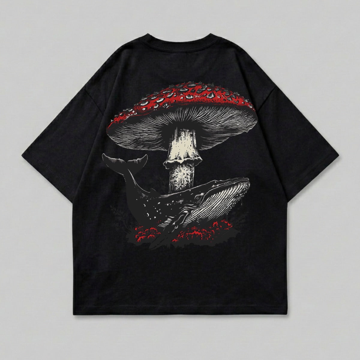 Black t-shirt with a large red mushroom and a whale illustration.
