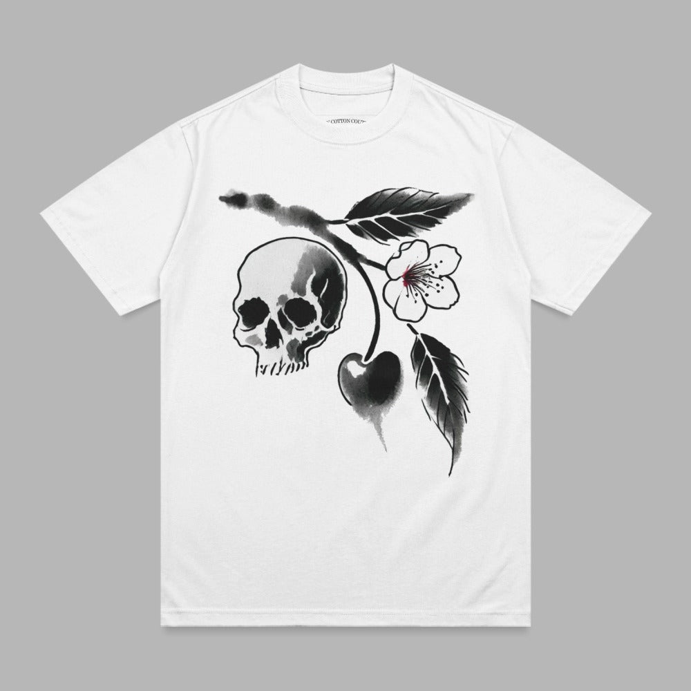 White t-shirt with a black ink illustration of a skull and cherry branch.