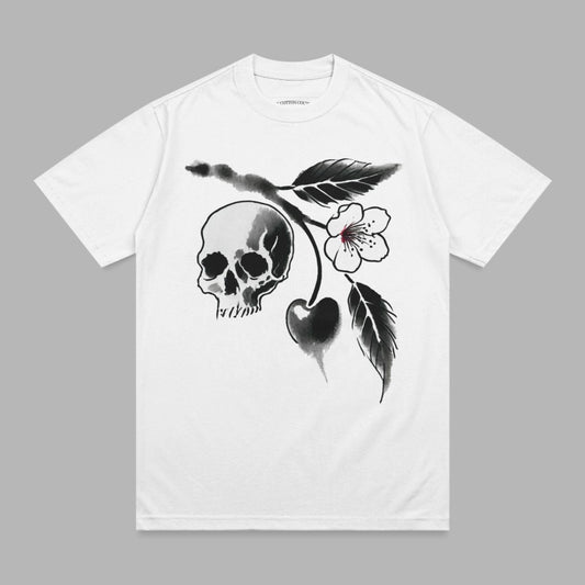 White t-shirt with a black ink illustration of a skull and cherry branch.