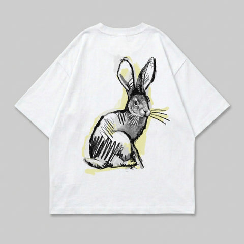 White t-shirt with a sketched rabbit graphic in black and yellow.