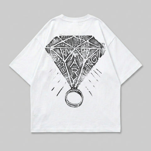 White t-shirt with diamond and ring graphic on the back.