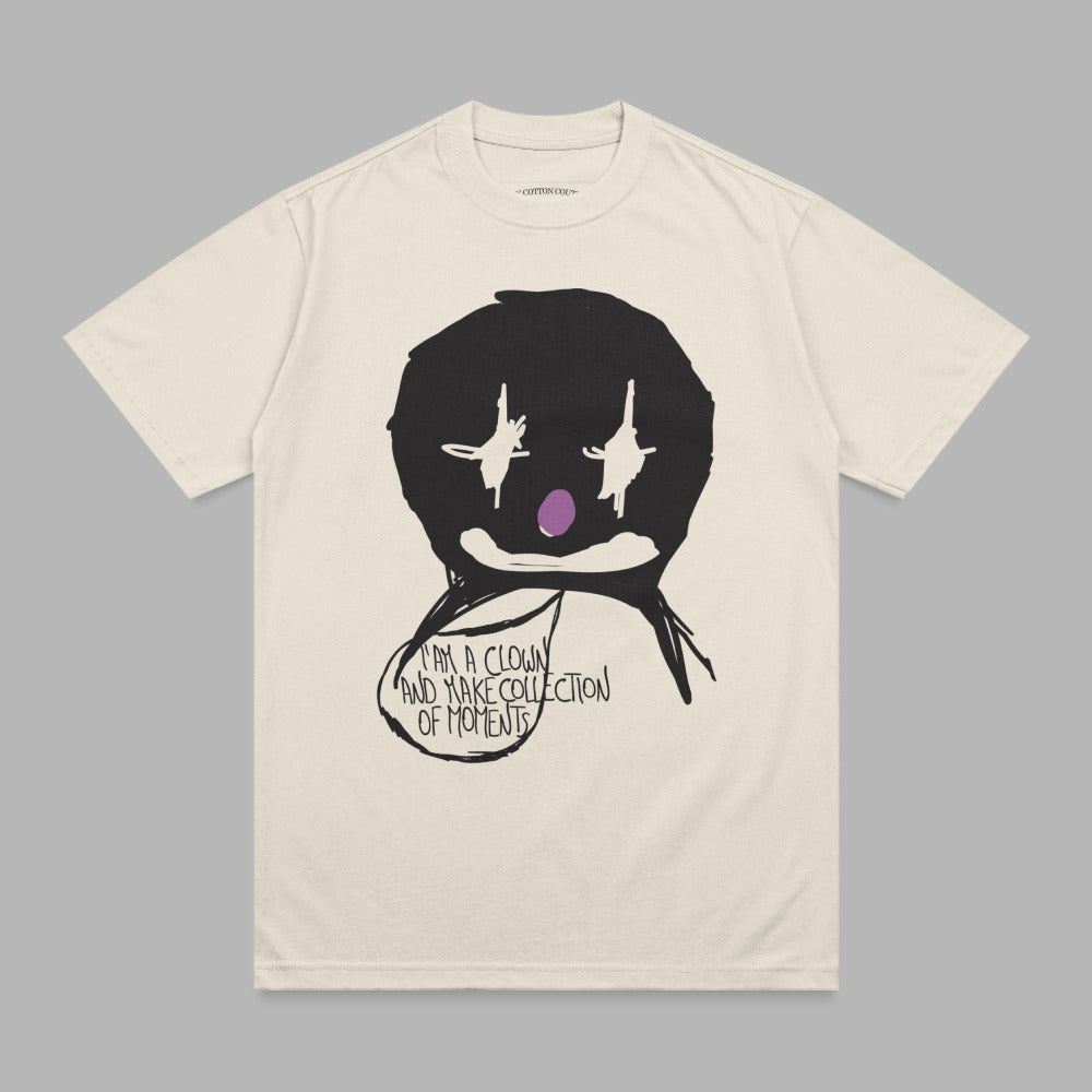 Cream t-shirt with black clown graphic and text "I AM A CLOWN AND MAKE COLLECTION OF MOMENTS".
