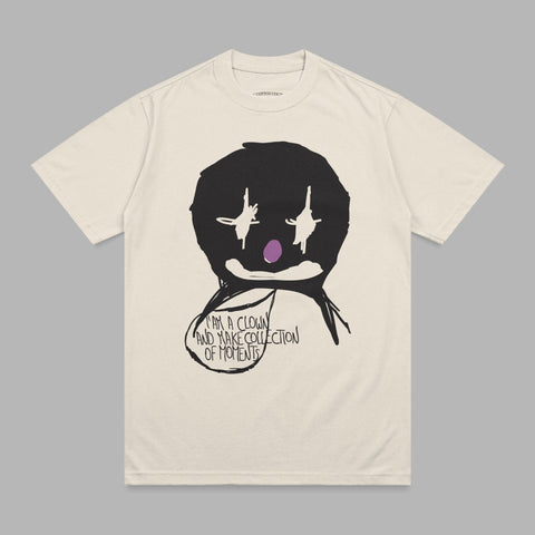 Cream t-shirt with black clown graphic and text "I AM A CLOWN AND MAKE COLLECTION OF MOMENTS".