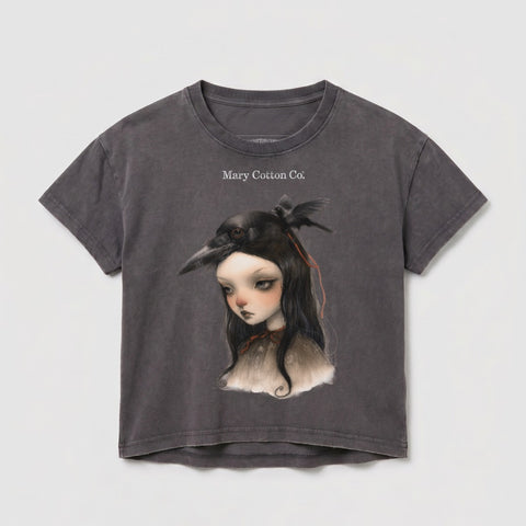 Dark gray t-shirt with a girl wearing a bird mask and Mary Cotton Co. logo.
