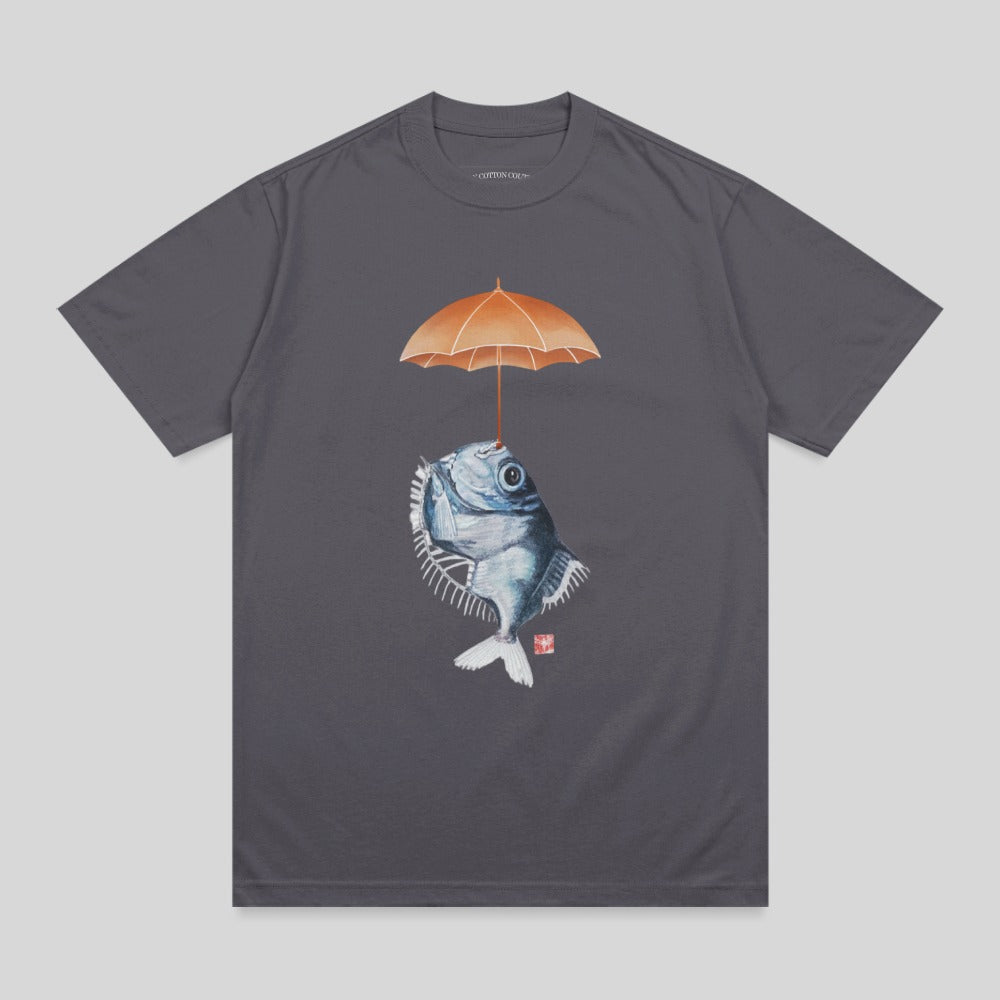 Fish with an umbrella overhead, on a dark grey t-shirt.