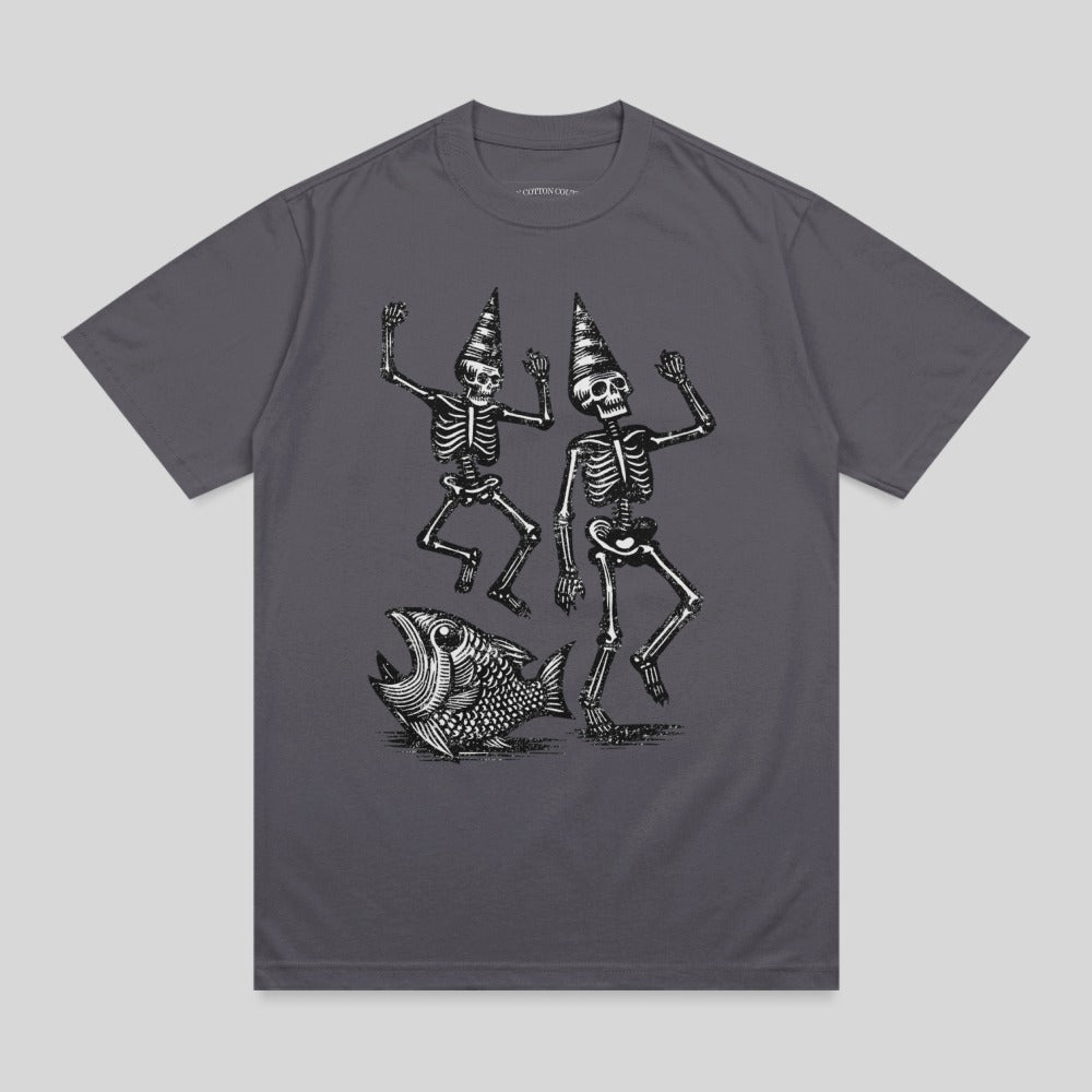 Two dancing skeletons in party hats next to a large fish.