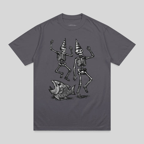 Two dancing skeletons in party hats next to a large fish.