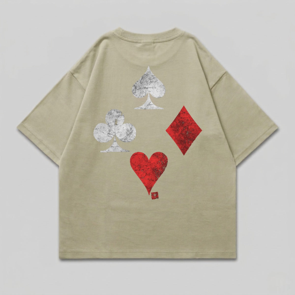 Tan t-shirt with distressed spade, club, diamond, and heart suit symbols on back.
