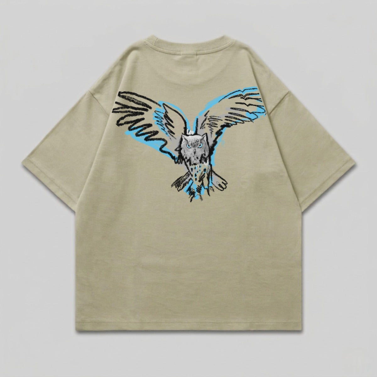 Tan t-shirt with a stylized owl with spread wings graphic on the back.