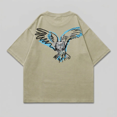 Tan t-shirt with a stylized owl with spread wings graphic on the back.