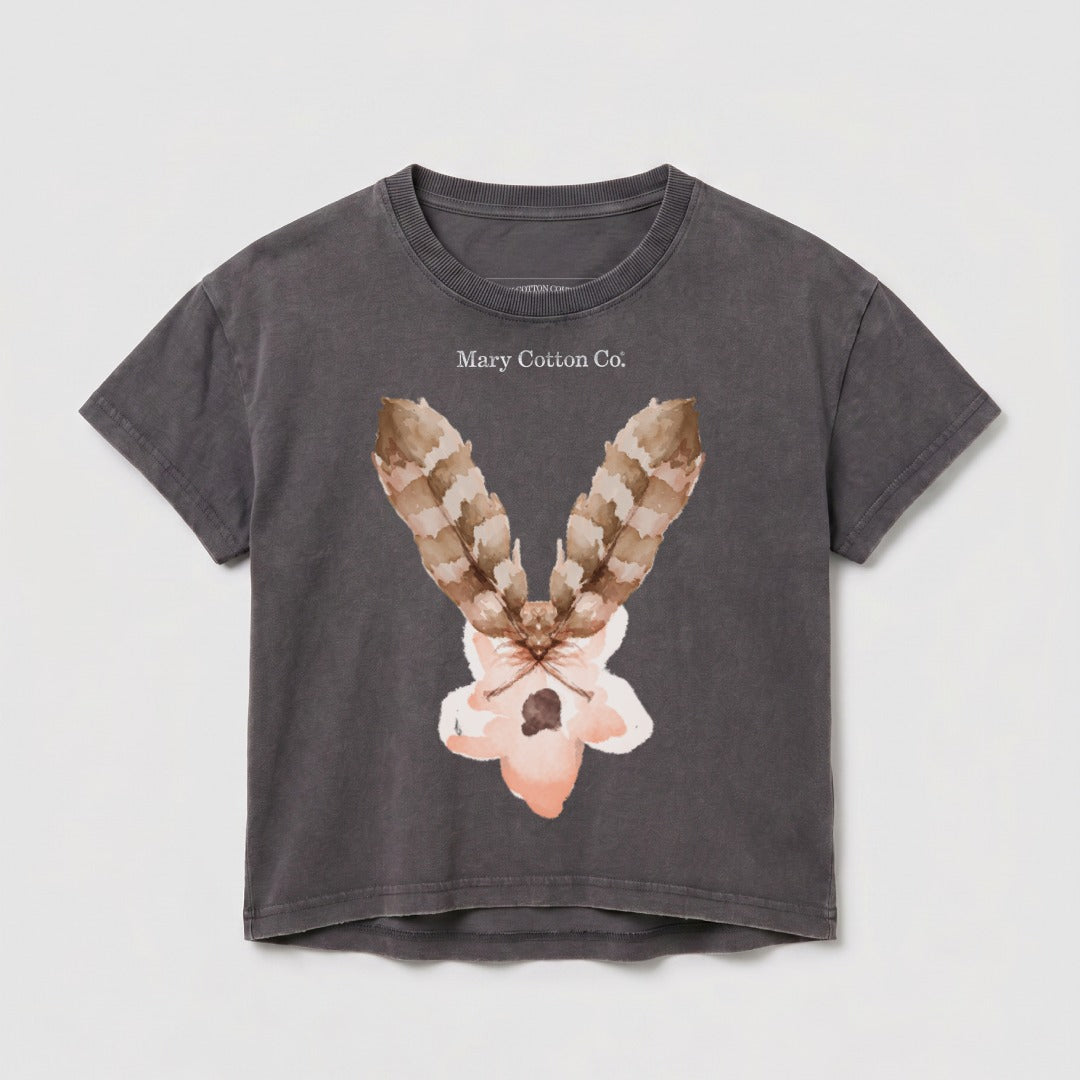 Dark grey cropped t-shirt with a floral and feather graphic and "Mary Cotton Co." text.
