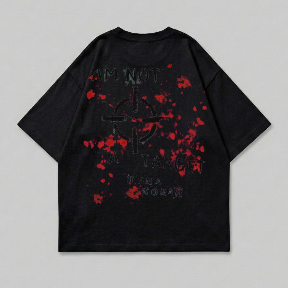 Black t-shirt with a red splatter target and text "I AM NOT A TARGET I AM A WOMAN".