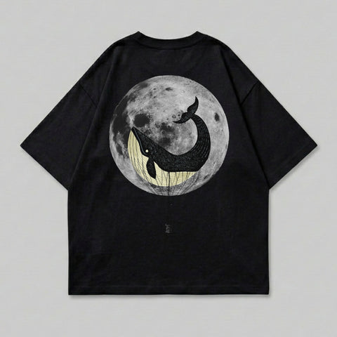 Black t-shirt with a whale in a hot air balloon against a full moon.