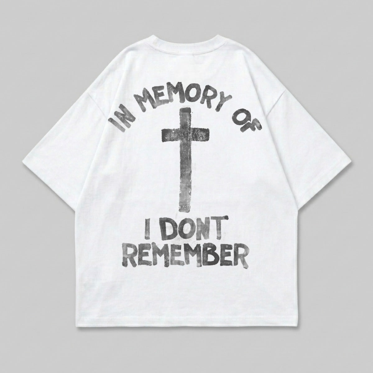 White t-shirt with black cross and "IN MEMORY OF I DON'T REMEMBER" text.