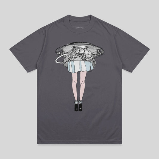 T-shirt with a woman's legs and skirt emerging from an overturned teacup.