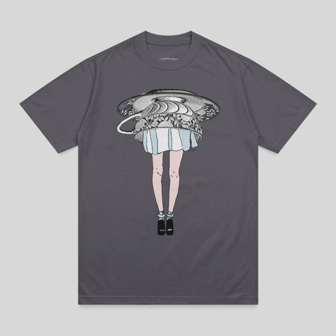 T-shirt with a woman's legs and skirt emerging from an overturned teacup.