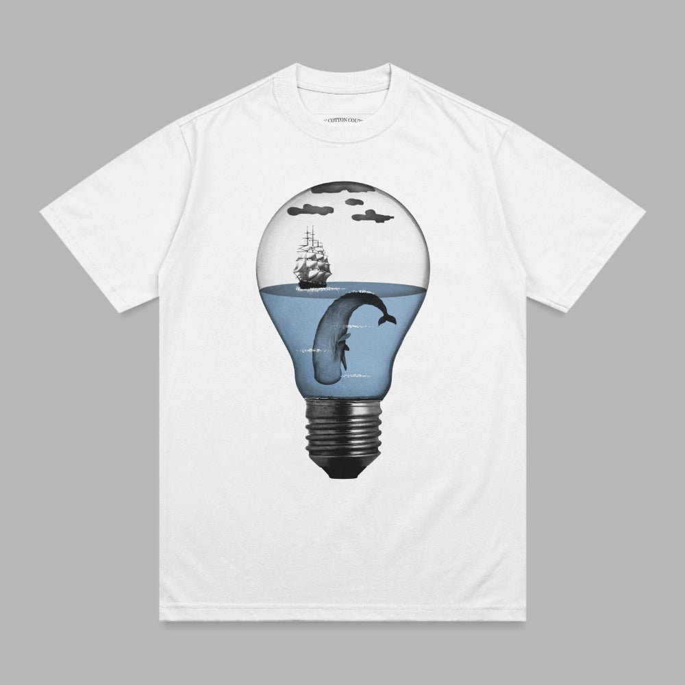 T-shirt with a lightbulb containing a whale, ship, and ocean.