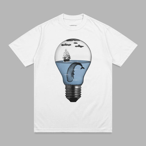 T-shirt with a lightbulb containing a whale, ship, and ocean.