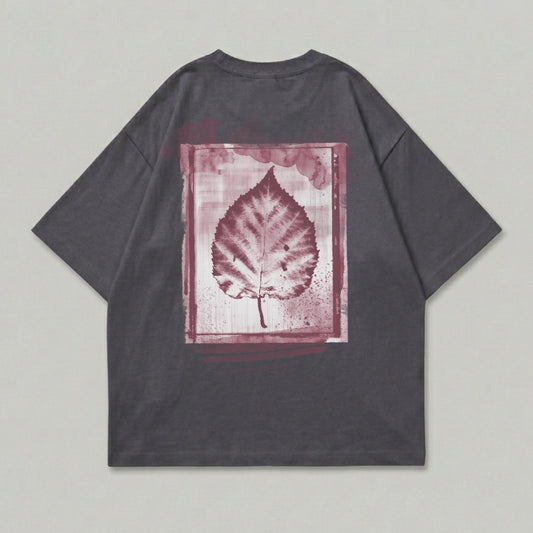 Dark grey t-shirt with a maroon leaf print in a painted frame.