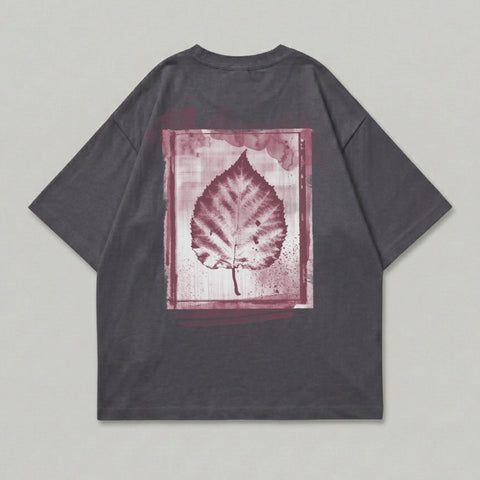 Dark grey t-shirt with a maroon leaf print in a painted frame.